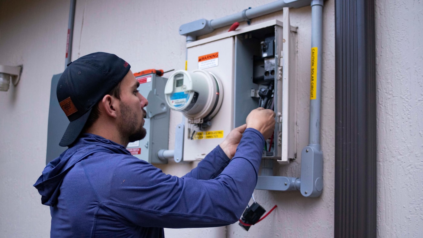 Spa technician working on electrical control panel